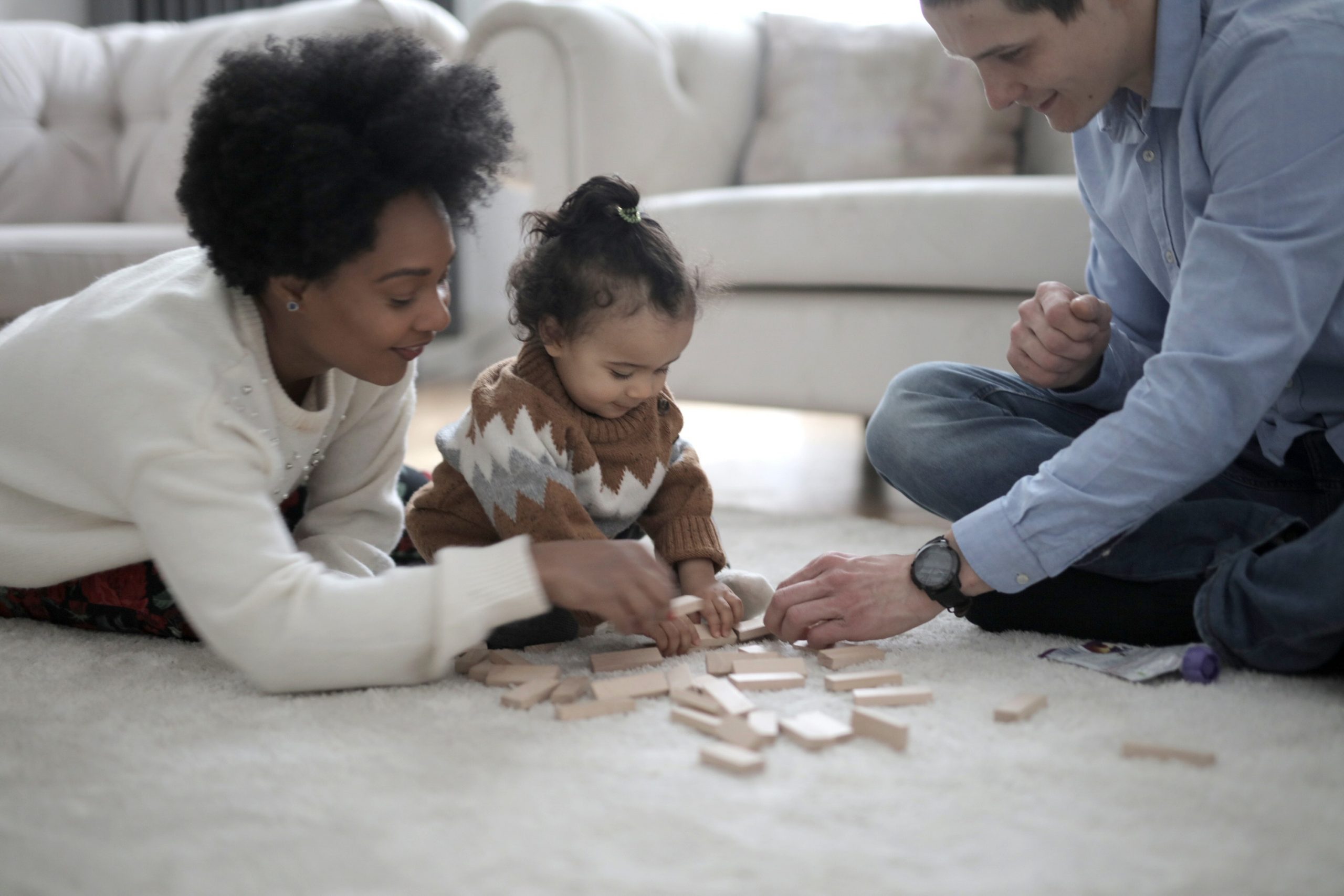 family playing on the floor